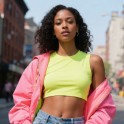 A pixelated image of a woman in pink jacket and yellow vest in a smaller size