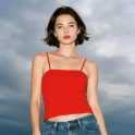A thumbnail of a lady wearing a red shirt in front of a gloomy sky