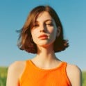 Thumbnail of a girl in orange