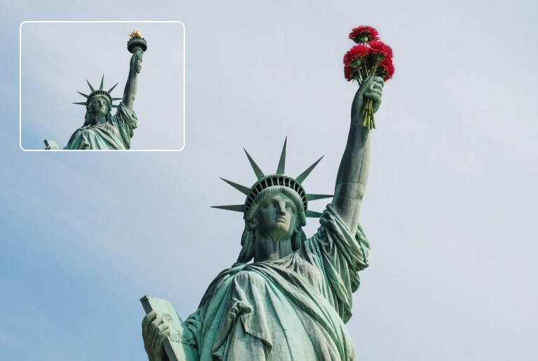 Replace the torch of the statue of liberty in the photo with flowers